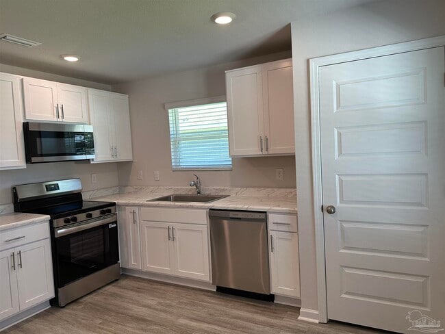 Building Photo - 6497 Firefly Dr