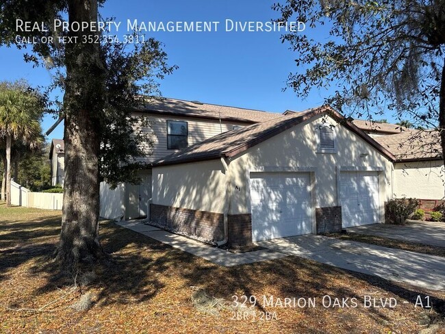 Building Photo - Charming 2/2 Town House With Garage