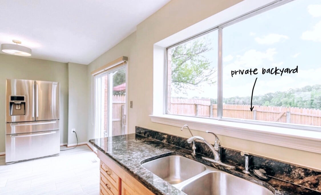 Another view of the kitchen with French door refrigerator. - 4767 Kandel Ct