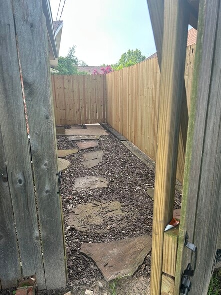 New privacy fence installed around entrance - 2812 Anita Ln