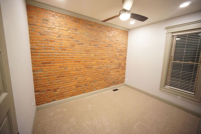 exposed brick in secondary bedroom - 1295 Kutchins Pl