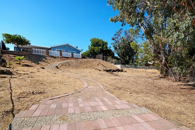 Building Photo - Beautiful 3BD 2BA House Sitting on Over 1/...