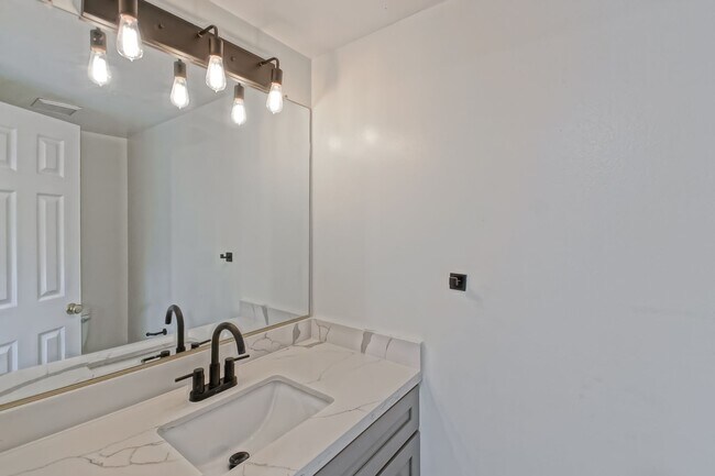 Building Photo - PRIME POOLFRONT LOCATION & CLOSE TO MAIN GATE! BRIGHT & SPACIOUS, END-UNIT POOLFRONT TOWNHOUSE W/...