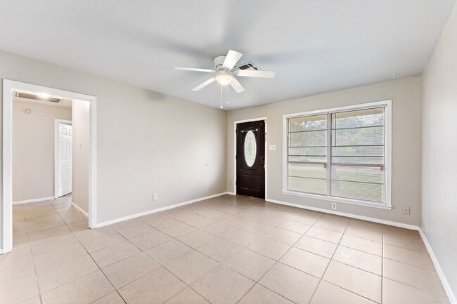 Building Photo - Beautifully remodeled 4 bedroom bath and a half with ceramic tile through out and laminate floori...
