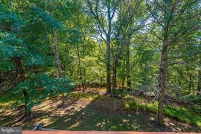 Building Photo - WELL MAINTAINED TOWNHOUSE WITH ONE CAR GARAGE, DECK,