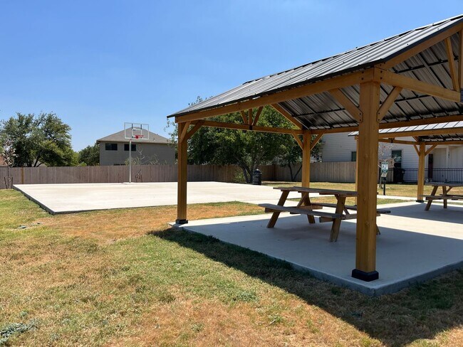 Building Photo - Move Fast! Gated Townhome Near Lackland AFB with Private Yard & EV-Ready Garage