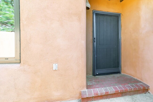 Building Photo - Two Story Condo Just off Old Taos Highway ...