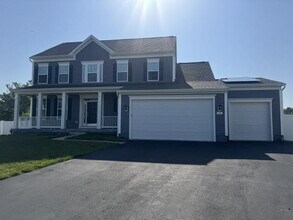 Building Photo - Luxury 4 Bedroom Home with Finished Walk-Out Basement, 3-Car Garage, Solar Power & EV Charging. A...