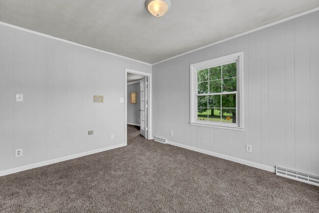 Building Photo - spacious 4-bedroom, 2.5-bath home featuring a 2-car garage and fresh updates throughout.