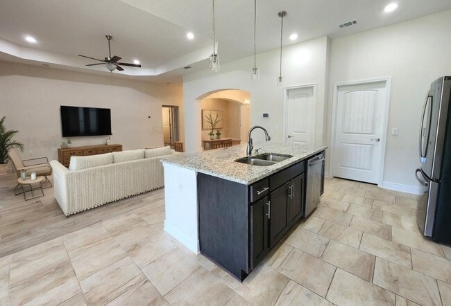 Building Photo - Welcome to this stunning 4-bedroom, 3-bath...
