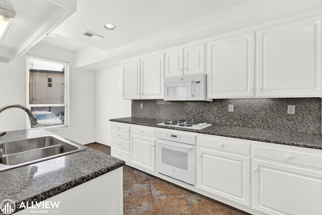 Building Photo - Spacious Coastal Condo with Rooftop Ocean ...