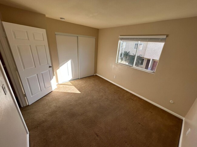 Building Photo - 2 Bedroom 1.5 Bath Townhome. Gated Community. Upgraded & 2 Parking Spaces