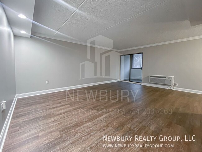 Building Photo - Luxury 1-Bedroom Penthouse with Modern Ren...