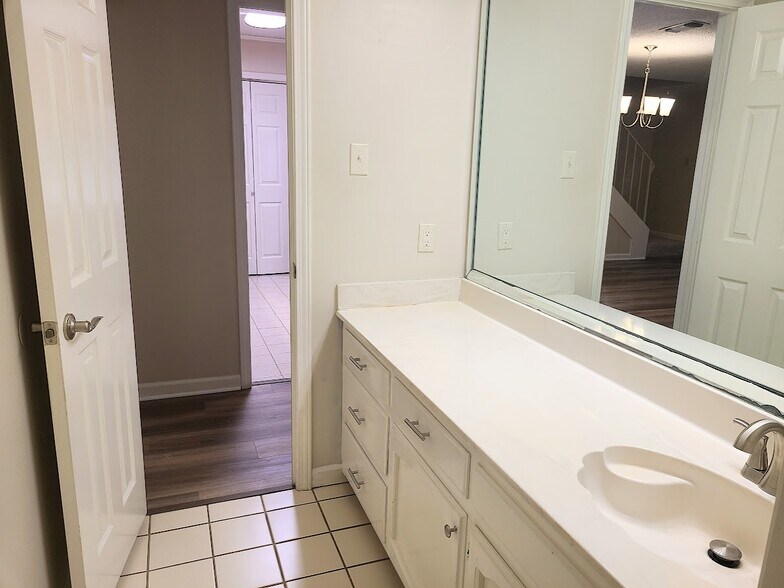 Guest bath with large vanity and storage - 12439 Coursey Blvd