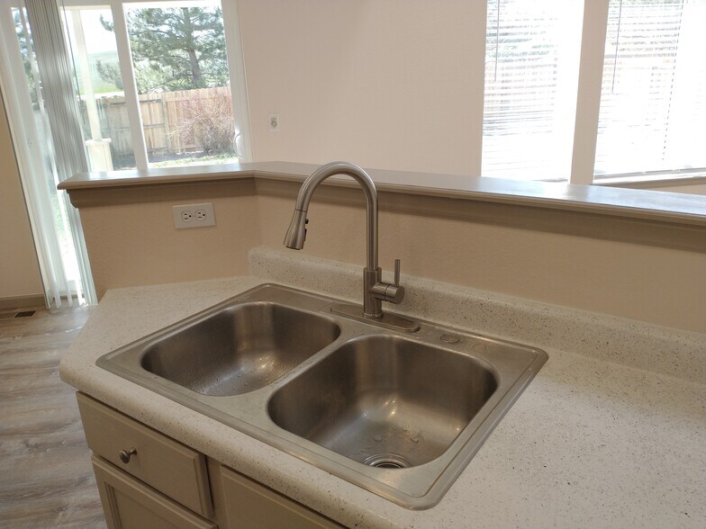 View from Kitchen to outside - 2225 Andrew Dr