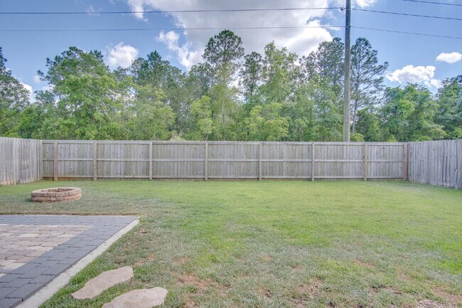 Building Photo - Spacious 4BR/2BA Brick Home with 2-Car Garage, Granite Kitchen, Vaulted Ceilings & Fully Fenced B...