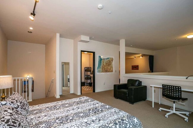 Building Photo - Gorgeous loft-style 2 floor condo with secured parking, A/C and rent includes most utilities!