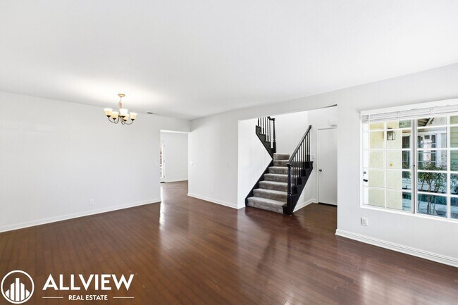 Building Photo - Fully Renovated 2 Bed Townhome with Private Patio, 2-Car Garage & Community Pool
