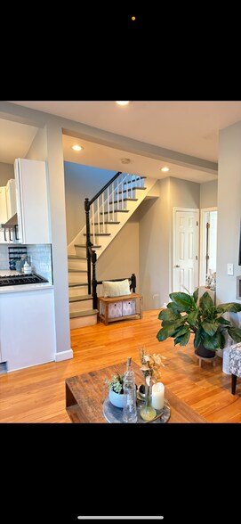 Living Room with interior stairway to private roof deck - 18 Concord St