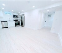 Building Photo - Fully Renovated, Sunny Basement Apartment