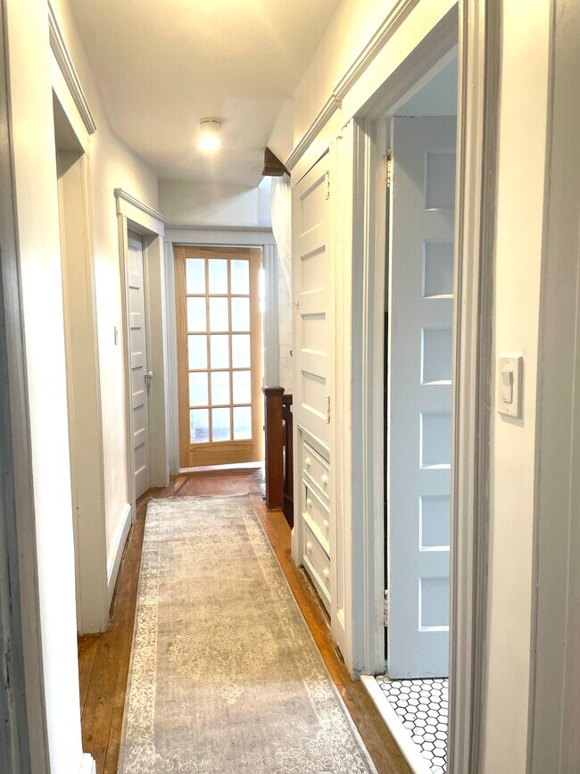 Corridor on 2nd floor with view of the french door of the 5th bedroom - 499 Highland Ave