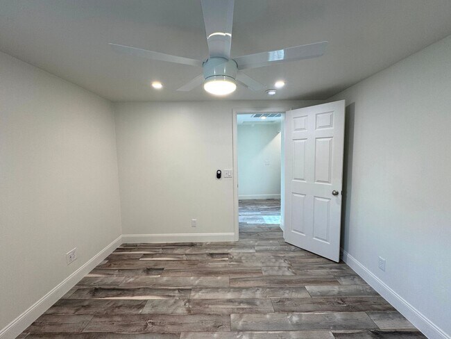 Building Photo - RENOVATED 3 bedroom end unit across the street from the Beach!