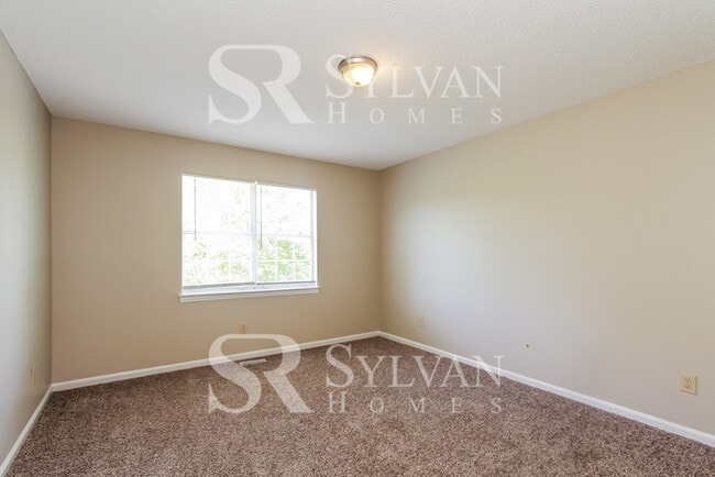 Building Photo - The living is easy in this 3 bedroom, 2 bathroom home