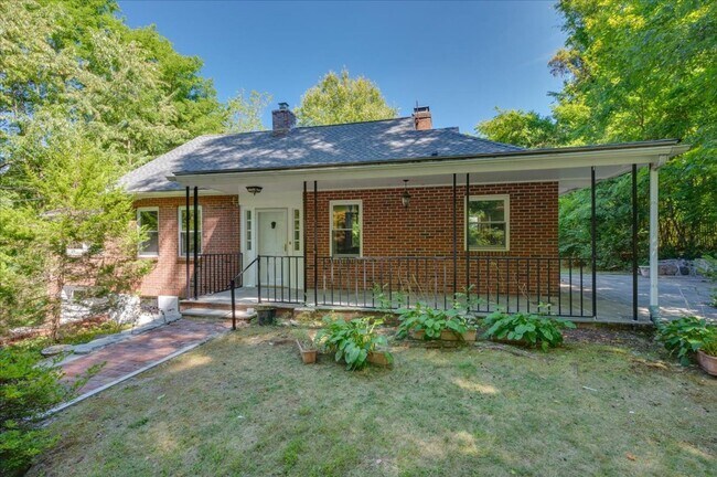 Building Photo - Elegant Multi-Level Brick Residence with Outdoor Oasis