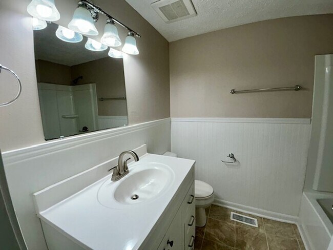 Building Photo - Welcome Home to This Beautifully Maintained Tri-Level Gem!