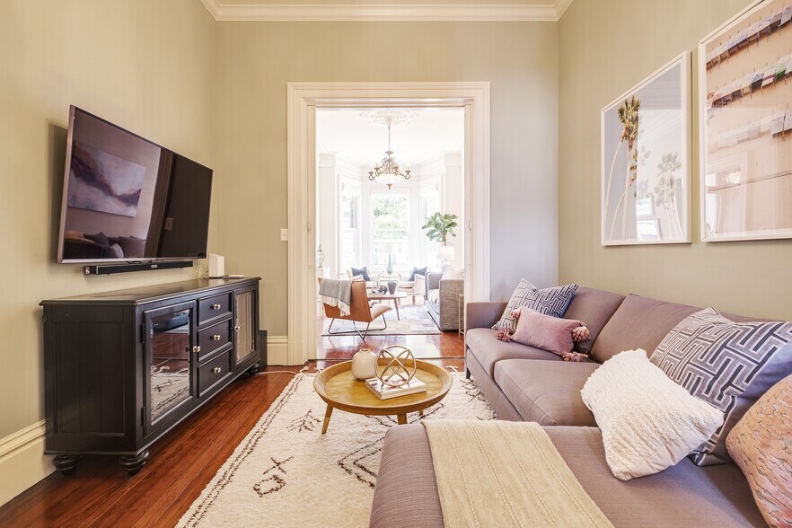 Back Downstairs Double Living room separated by original pocket doors over 12 ft tall - 2188 Sutter St