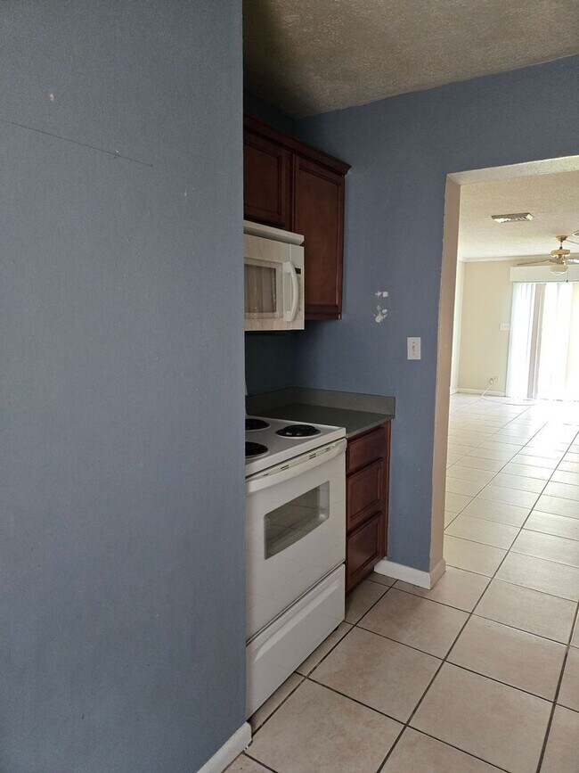 Building Photo - Palms West Condo-Oncu