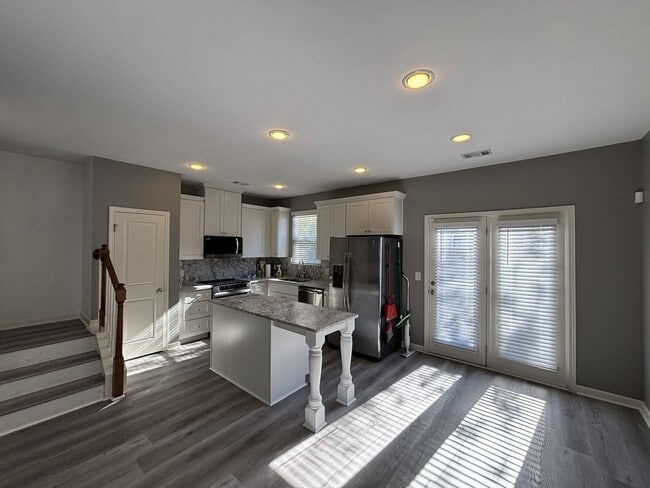 Building Photo - Gated Private Community! Spacious 3 Bedroom and 2.5 Bath End Unit Townhome