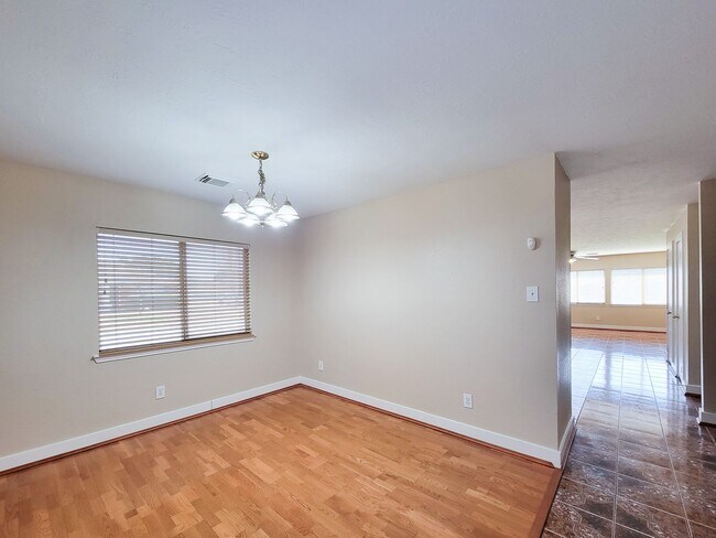 Building Photo - 3 bedroom one story home on large corner lot. Home has hard flooring throughout living areas and ...