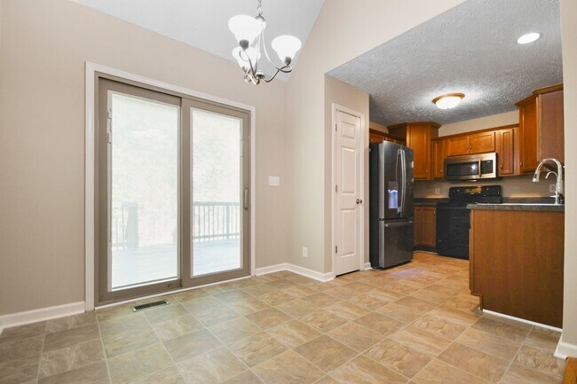 Building Photo - Pet Friendly Three Bedroom with Bonus!