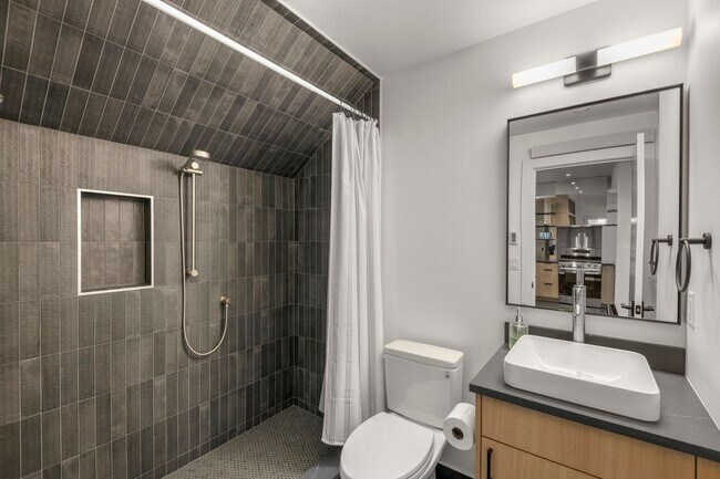 Building Photo - Stunning remodeled apartment with large walk-out patio