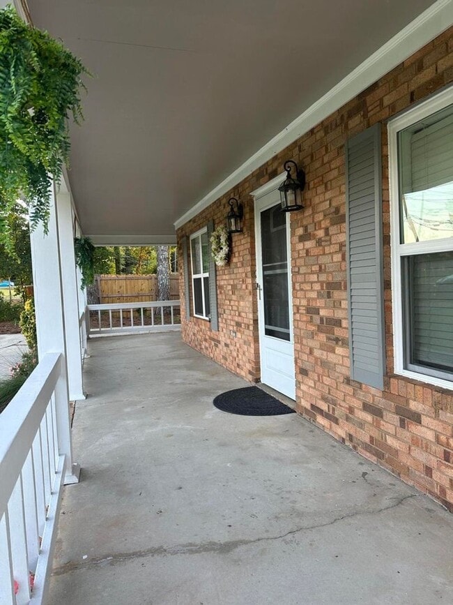 Building Photo - Move-In Ready Corner-Lot Home with Wraparound Porch Near Fort Eisenhower