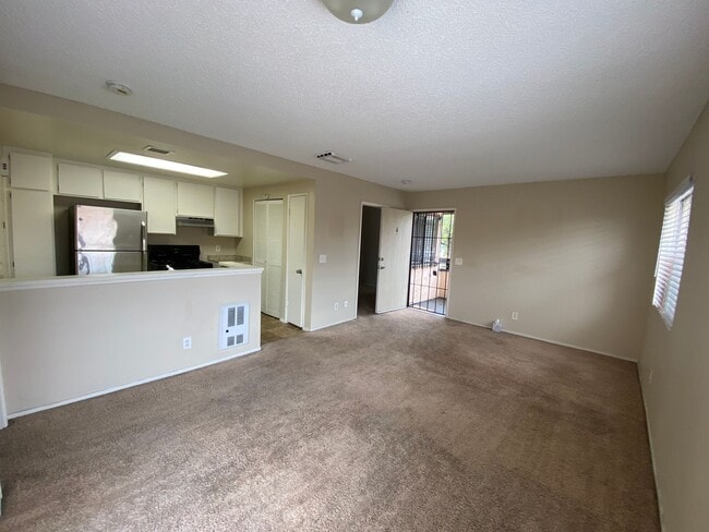 Building Photo - 2 BR 2 BA Corner Condo w/Balcony W/D Gated Entry Carport + Space