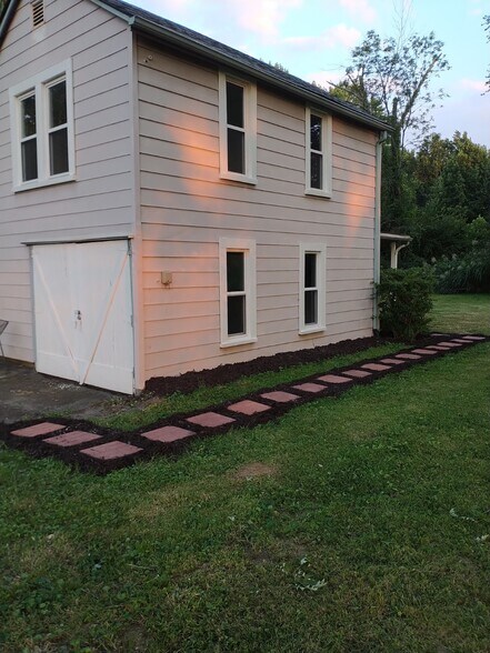 New pavers lead to the back door. - 10106 Wingfield Rd