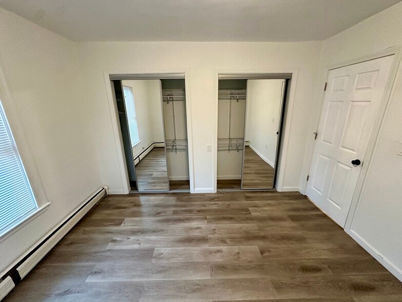 Full closet with twin mirror sliding doors. - 8 Avon St