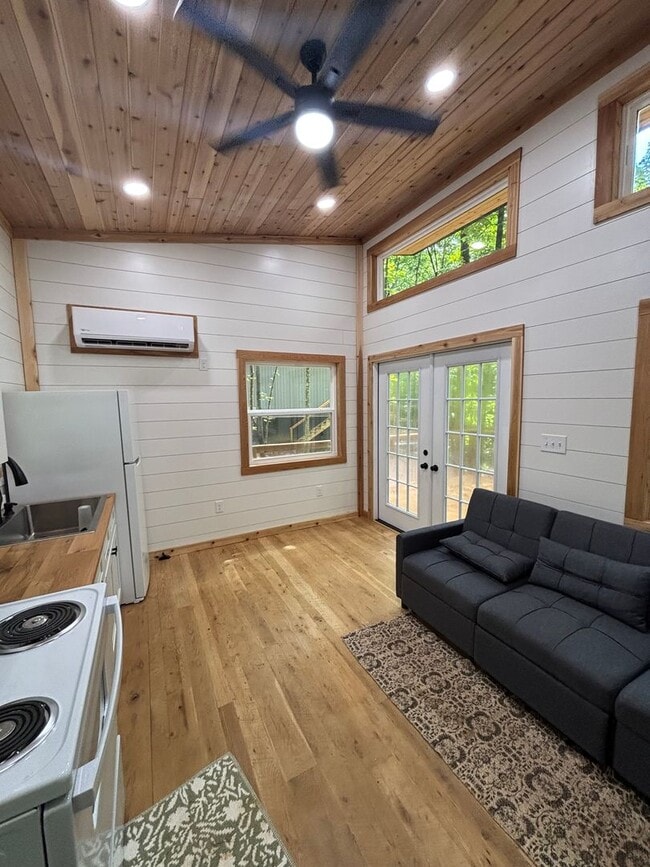 Building Photo - Cozy, Modern Tiny Home with Wrap-Around Po...