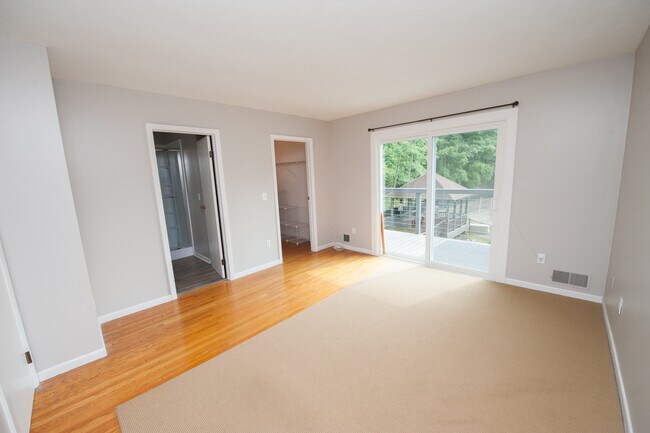 Primary Bedroom with private bath and access to Deck 2 - 260 Hogan Rd