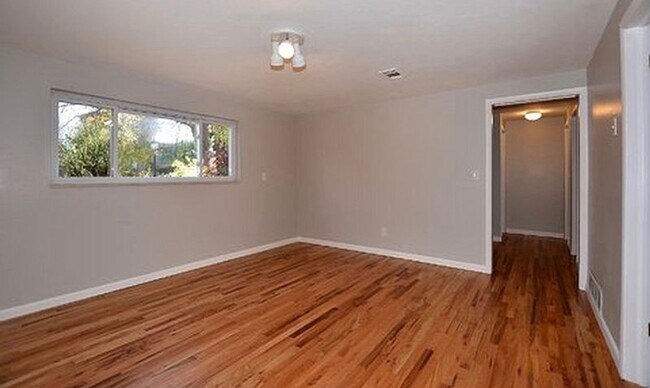 Building Photo - AVAILABLE AUGUST! Huge 4 bedroom/2 bath home with large fenced yard