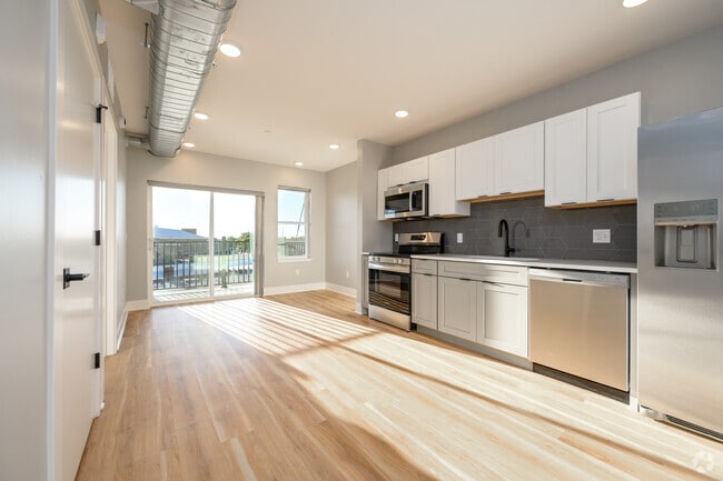 1BR, 1BA - 383SF - Living Room and Kitchen - The Watershed