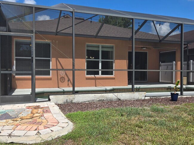 Building Photo - Freshly Painted 4BR/2BA Pool Home with Screened Pool & Spa – Move-In Ready!
