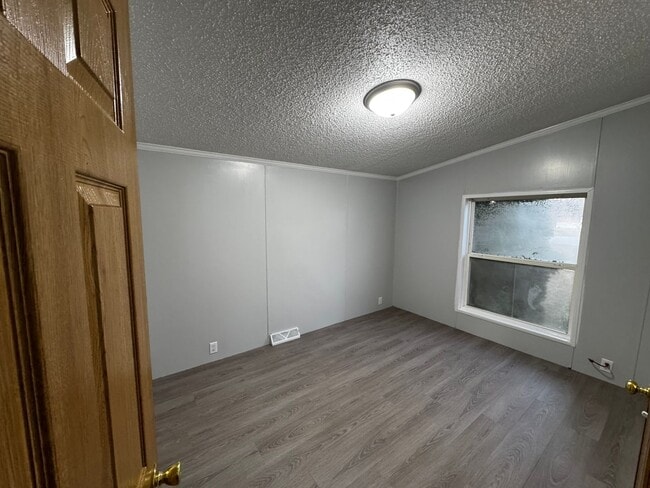 Building Photo - Very large yard great location a nice older doublewide Home