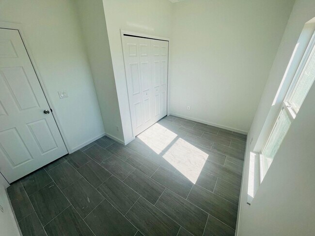 Building Photo - NEW CONSTRUCTION-  Modern 3 Bed / 2 Bath Home in Lehigh Acres