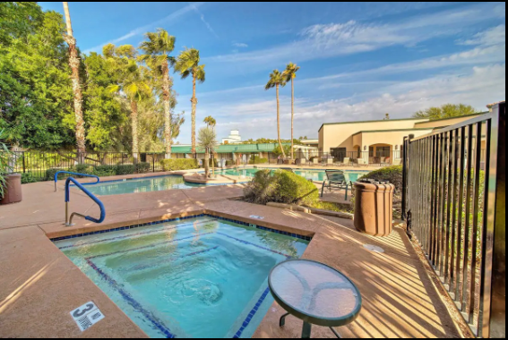 Hot tub view with pool in backgraound - 7350 N Pima Rd