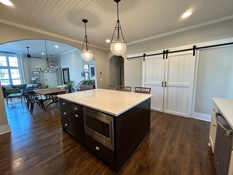 Large kitchen with stainless steel appliances, garbage disposal, dishwasher and huge pantry - 405 E 32nd Ave