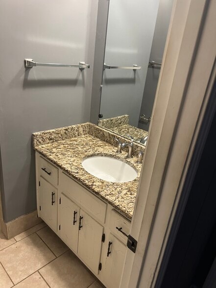 Granite vanity in main bath upstairs - 1140 E Main St