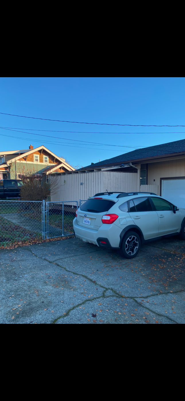 fenced yard & driveway - 706 Naval Ave